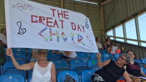 Choir members at Twerton Park in Bath