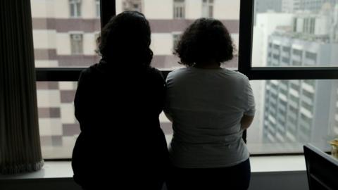 Sisters from Saudi Arabia, who go by aliases Reem and Rawan, are pictured at an office in Hong Kong on 23 February