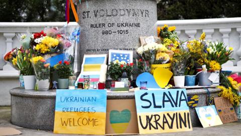 Flowers left at a statue to Ukraine's St Volodymyr in London