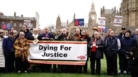 Infected blood victims and campaigners call for action on compensation payments in Westminster