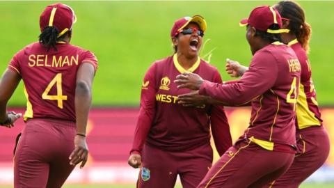 West Indies players celebrate a wicket