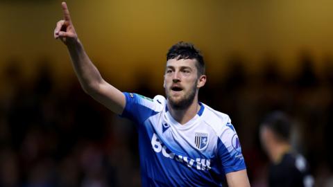 Ashley Nadesan celebrates a goal for Gillingham