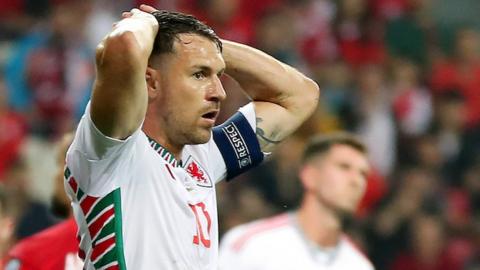 Wales captain Aaron Ramsey looks on in despair