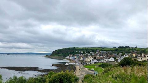 Cloudy skies over the bay at Whitehead, County Antrim. Picture taken by BBC Weather Watcher 'The Camera Man'