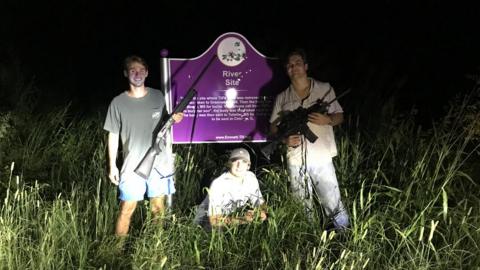 Three Ole Miss students flank the sign honouring slain civil rights icon Emmett Till