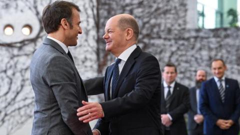 German Chancellor Olaf Scholz welcomes French President Emmanuel Macron before their trilateral meeting with Polish Prime Minister Donald Tusk for the consultation forum 'Weimar Triangle', at the Chancellery in Berlin, Germany March 15, 2024