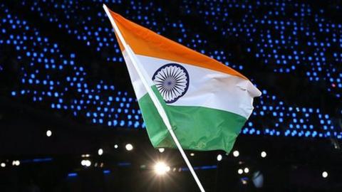 Sushil Kumar of the India Olympic wrestling team carries his country's flag during the Opening Ceremony of the London 2012 Olympic Games at the Olympic Stadium on July 27, 2012 in London, England.