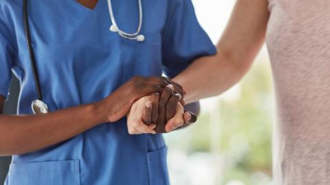 A nurse helping somebody