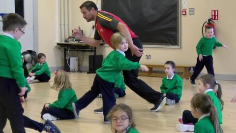 Primary school children playing 'freeze'