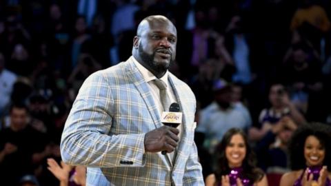 Former Los Angeles Lakers center Shaquille O"Neal speaks during a NBA game.