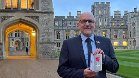 Zane Powles was handed the MBE by the Princess Royal, Princess Anne, at Windsor Castle