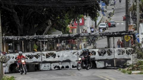 A burnt-out bus in Natal.