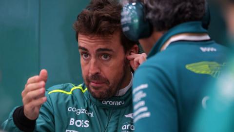 Aston Martin's Fernando Alonso in discussions with an engineer at the Saudi Arabian Grand Prix