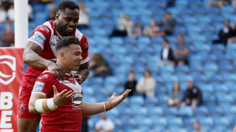 Tyler Dupree has a team-mate jump on his back in celebration of his try against Hull FC