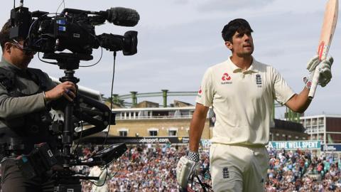 England's Alastair Cook raises his bat as he leaves the pitch after scoring 147 in his final Test