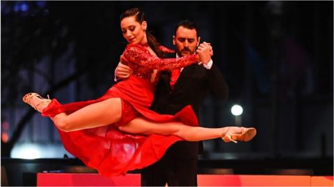 A couple dance in the final of World BA Tango 2022