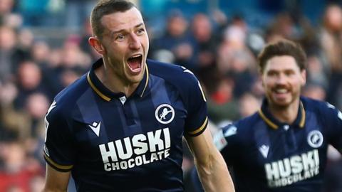 Murray Wallace (centre) scores for Millwall