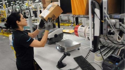 Worker in an Amazon fulfilment centre