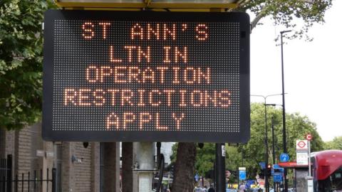An illuminated highway sign warning of the LTN in operation in St Ann's in the borough of Haringey.