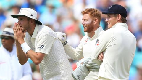 England's Stuart Broad, Jonny Bairstow and Joe Root wait for the third umpire's verdict ahead of the final wicket in the third Test