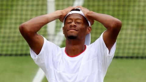 A shocked Christopher Eubanks puts his hands on his head