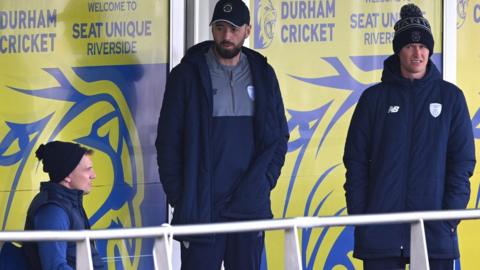 Hampshire and Durham players stand on balcony