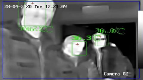 Image of three men on thermal camera