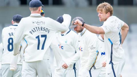 Yorkshire captain Steven Patterson congratulates David Willey