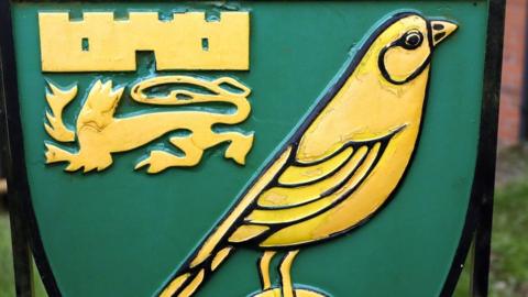 The iconic canary yellow Norwich City badge