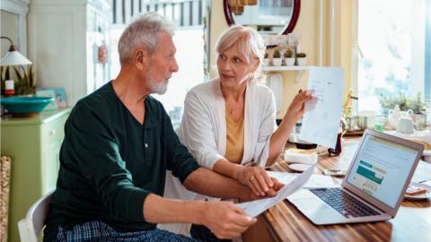 Couple discuss bills - stock shot