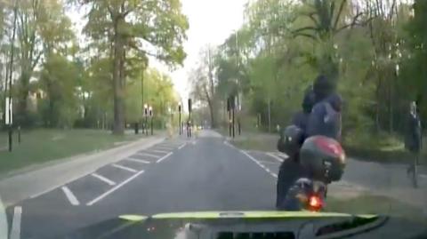 Motorbike hit by police car