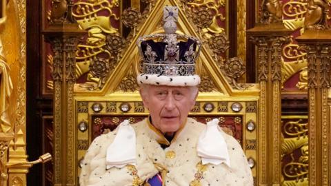 King Charles III pauses during the State Opening of Parliament at the Houses of Parliament on November 7, 2023 in London