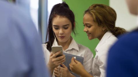 Girls looking at mobile phone