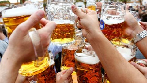 People toast with beer during Munich's Oktoberfest. File photo