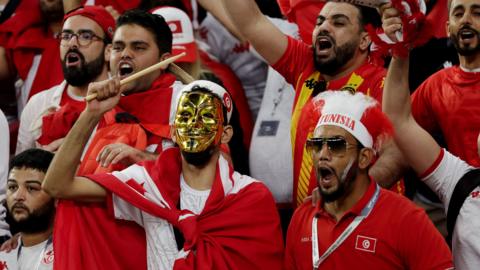 Tunisia fans cheer during their World Cup game against Denmark