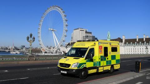 Ambulance crosses Westminster Bridge