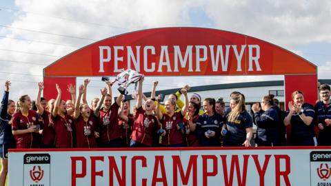 Cardiff Met players celebrate with the 2021-22 Adran Trophy