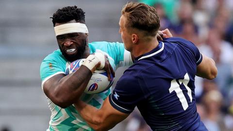 South Africa's Kolisi and Scotland's Van der Merwe in collision