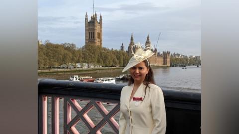 Mahtab "Matti" Morovat in front of Westminster Abbey