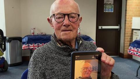 A 100-year-old man takes a selfie
