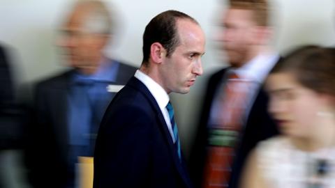 Stephen Miller walks quickly to Rose Garden