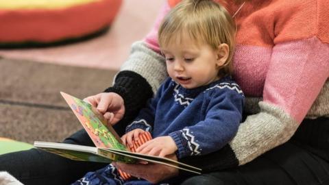 Baby reading a book