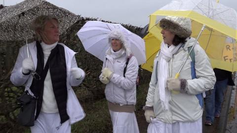 women in white protesters