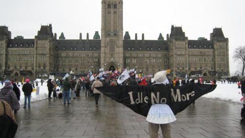 People protest outside of Canada's parliament in support of Attawapiskat Chief Theresa Spence's strike on January 11, 2013 in Ottawa, Ontario.