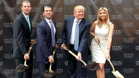 The Trump children holding shovels