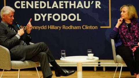 Hilary and Bill Clinton on stage in Swansea