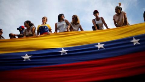 Opposition supporters attend a rally to pay tribute to victims of violence during protests against Venezuelan President Nicolas Maduro"s government in Caracas, Venezuela, July 24, 2017