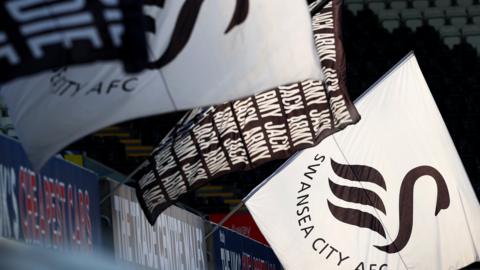 Swansea City flags flying at their stadium