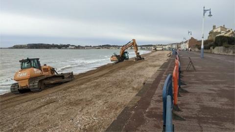 Diggers on Weymouth beach