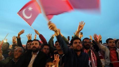 People wave Turkish flag 17 April